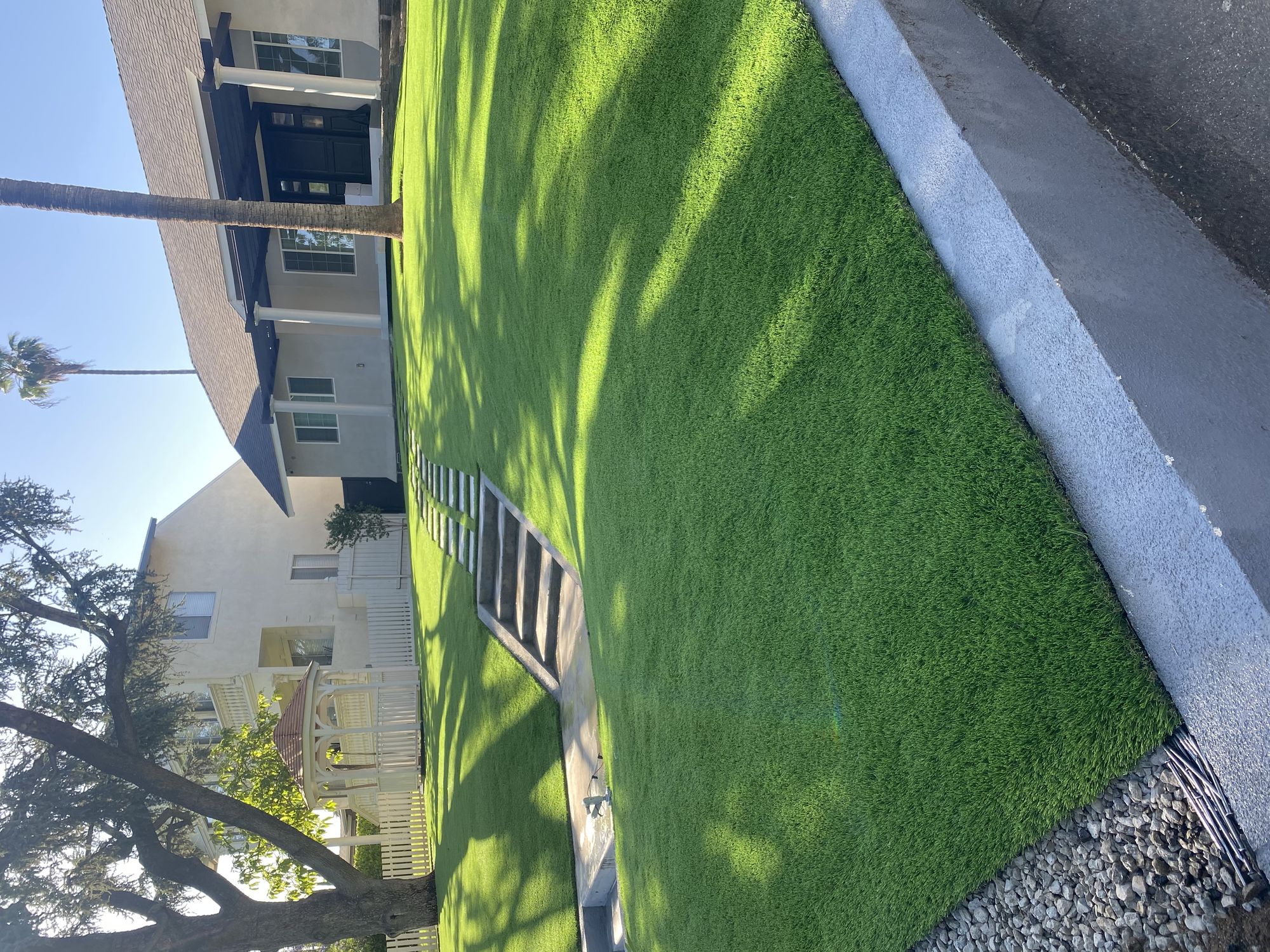 Lush artificial turf front lawn installed by 3RS Landscaping in Whittier, California