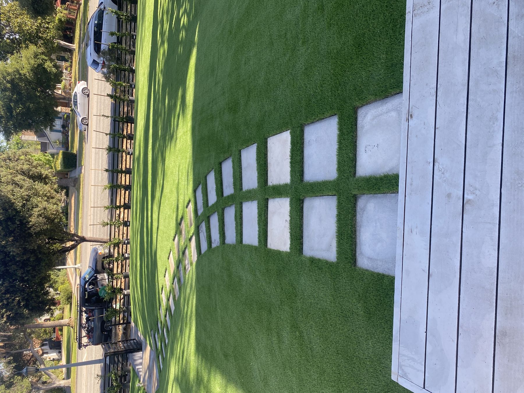 Artificial turf lawn with paver stepping stones installed by 3RS Landscaping